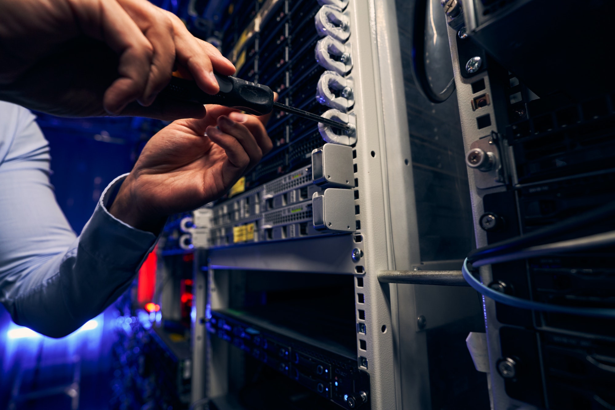 Engineer installing network equipment in data center