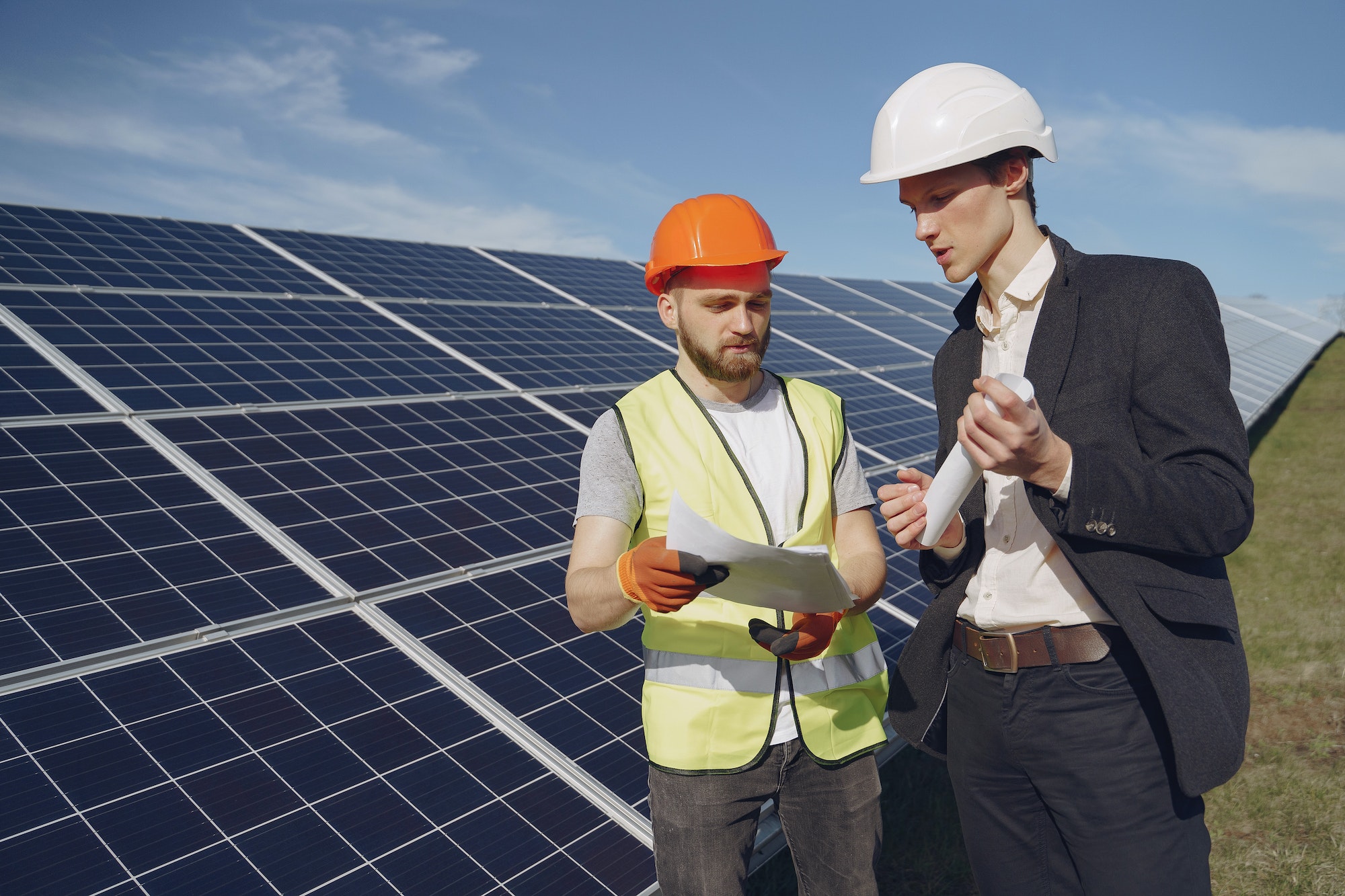 Foreman and businessman at solar energy station