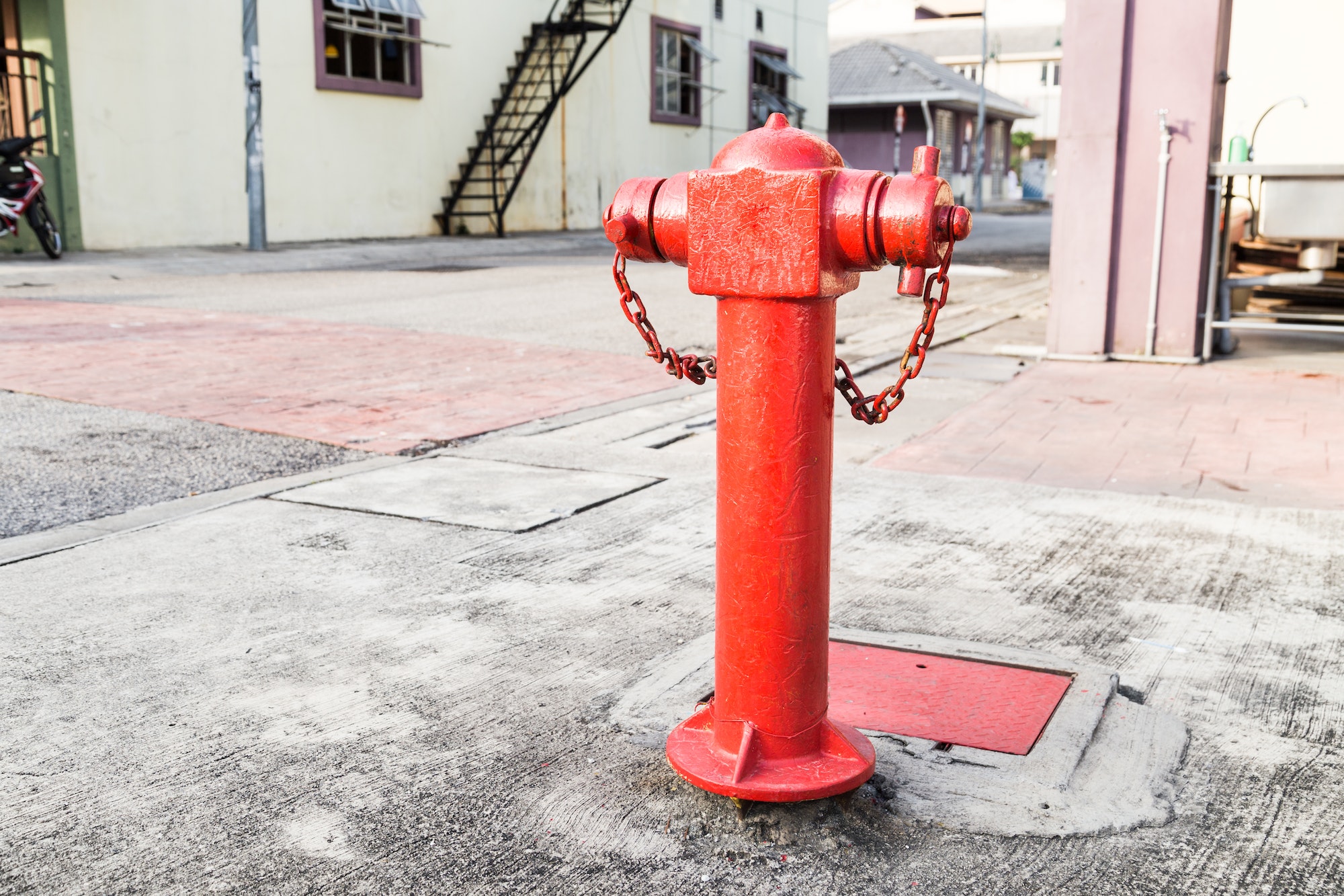 Red fire hydrant at strategic residential ready for emergency