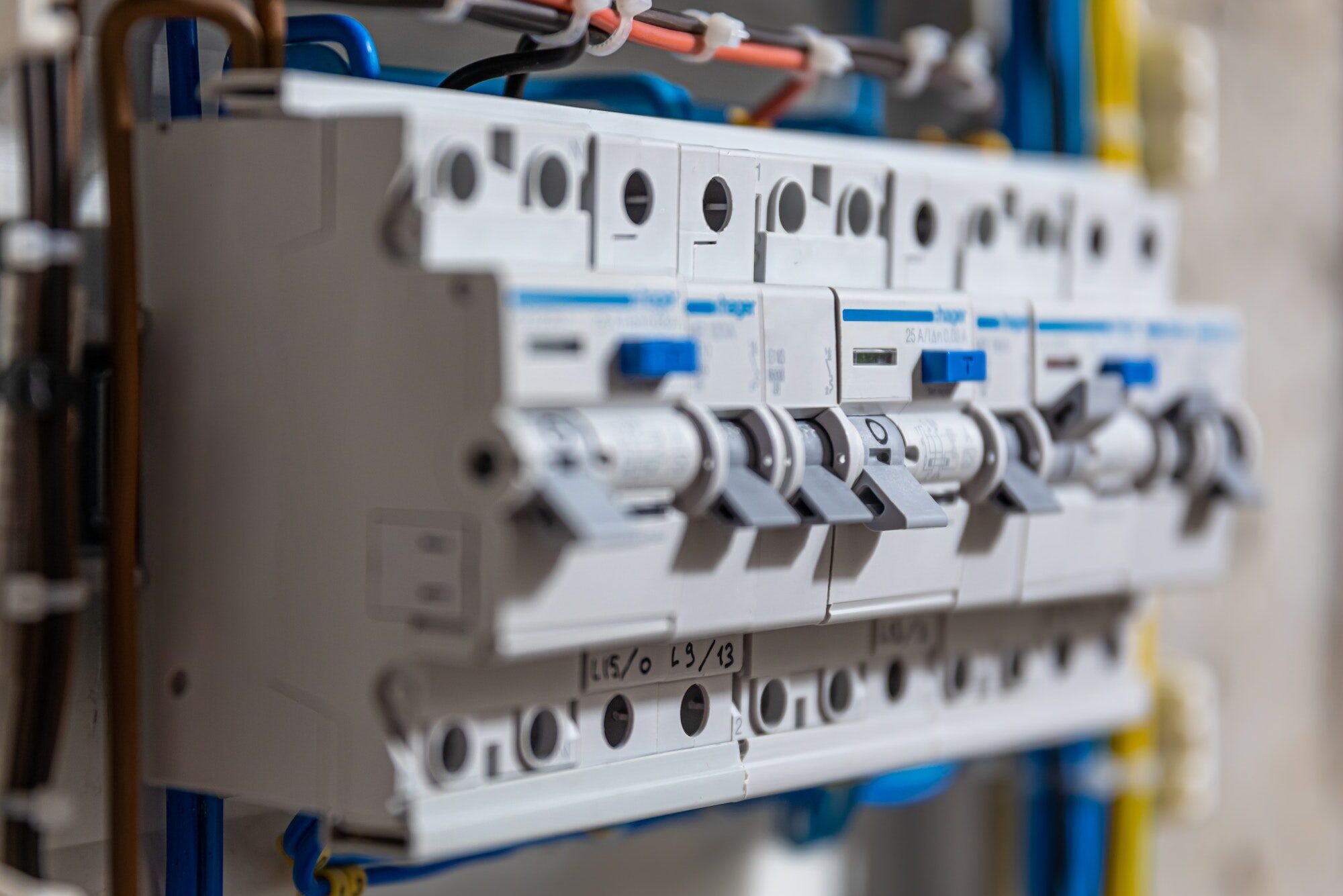 Switchboard with many switches and fiber optic cables.